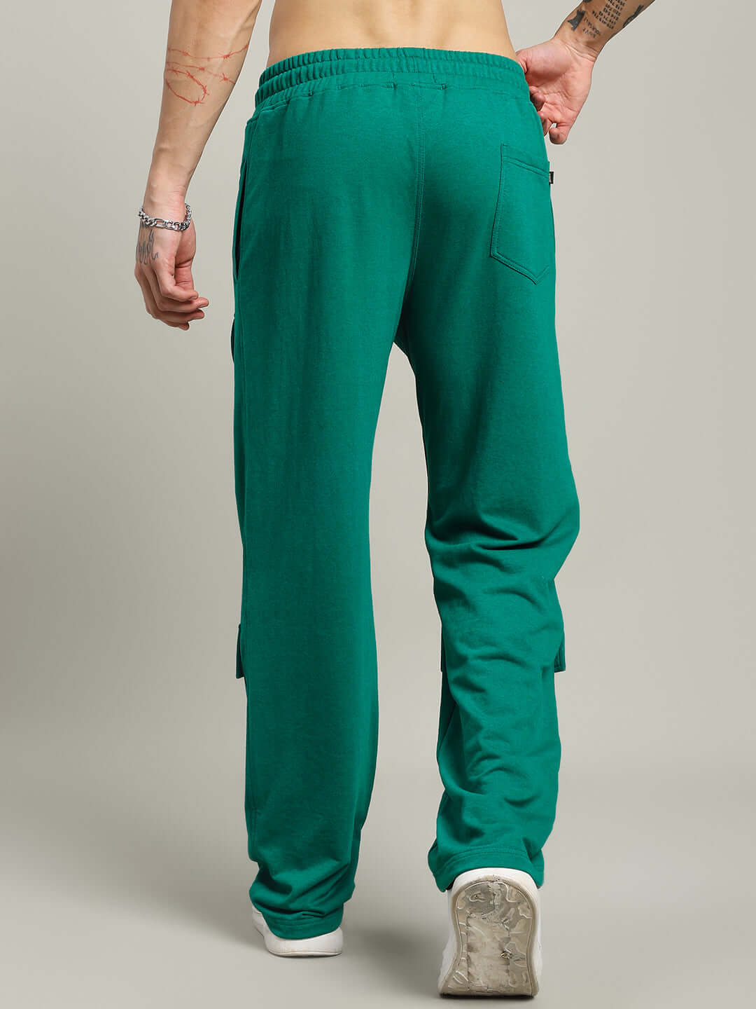 Back view of AWESOME FLAP POCKET BAGGY JOGGER GREEN showcasing relaxed fit and vibrant color in urban style.