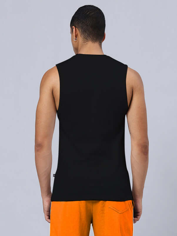 Back view of person wearing NO GRIT NO GLORY PRINTED RELAXED FIT GYM T-SHIRT BLACK with orange shorts.