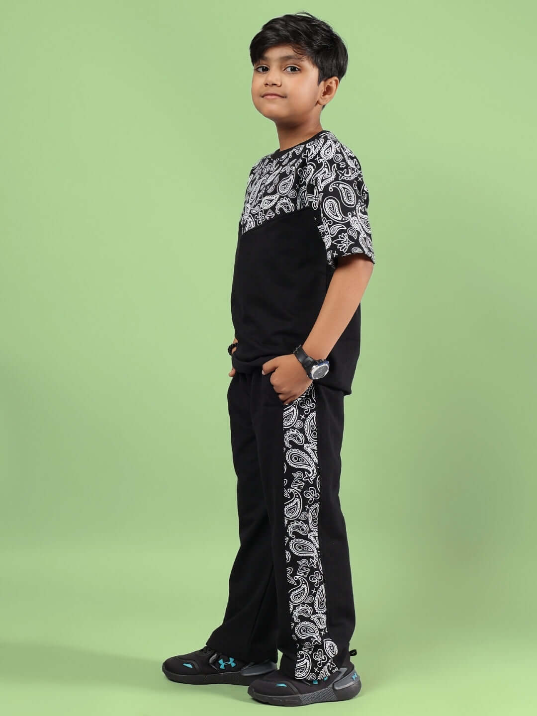 BALADEER CO-ORD FOR BOYS & GIRLS BLACK shown on a child against a green background, featuring a sporty design and comfortable fit.