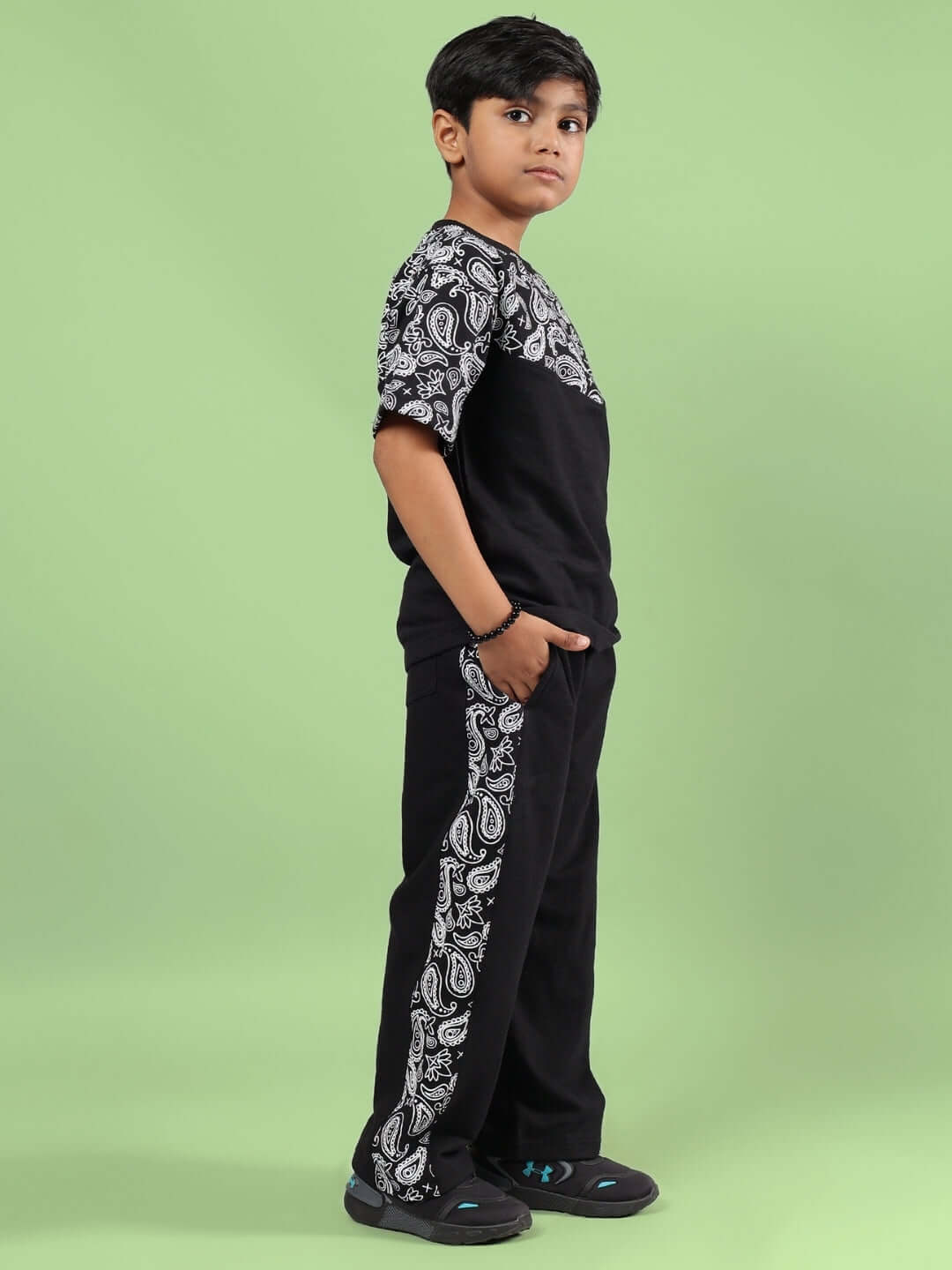 Child wearing BALADEER CO-ORD FOR BOYS & GIRLS BLACK with sporty design, ideal for active kids. Comfortable cotton fabric.