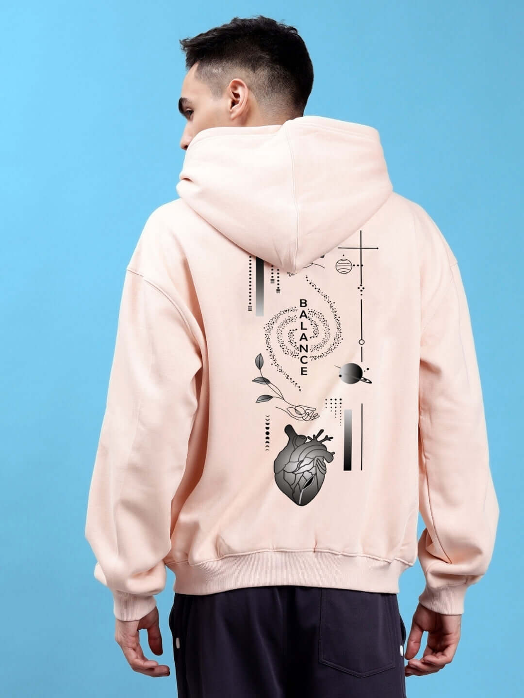 Back view of BALANCE OVER-SIZED FLEECE HOODIES BEIGE with artistic design, showcasing relaxed fit and soft beige color.