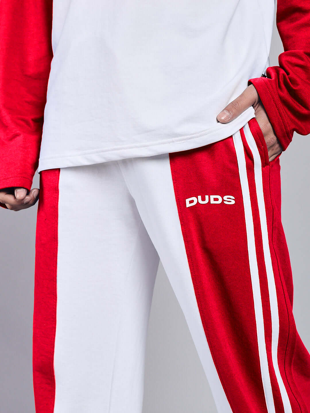 White and red relaxed fit joggers by DUDS with striped design, ideal for custom fit orders. Shipping in 7-10 days.
