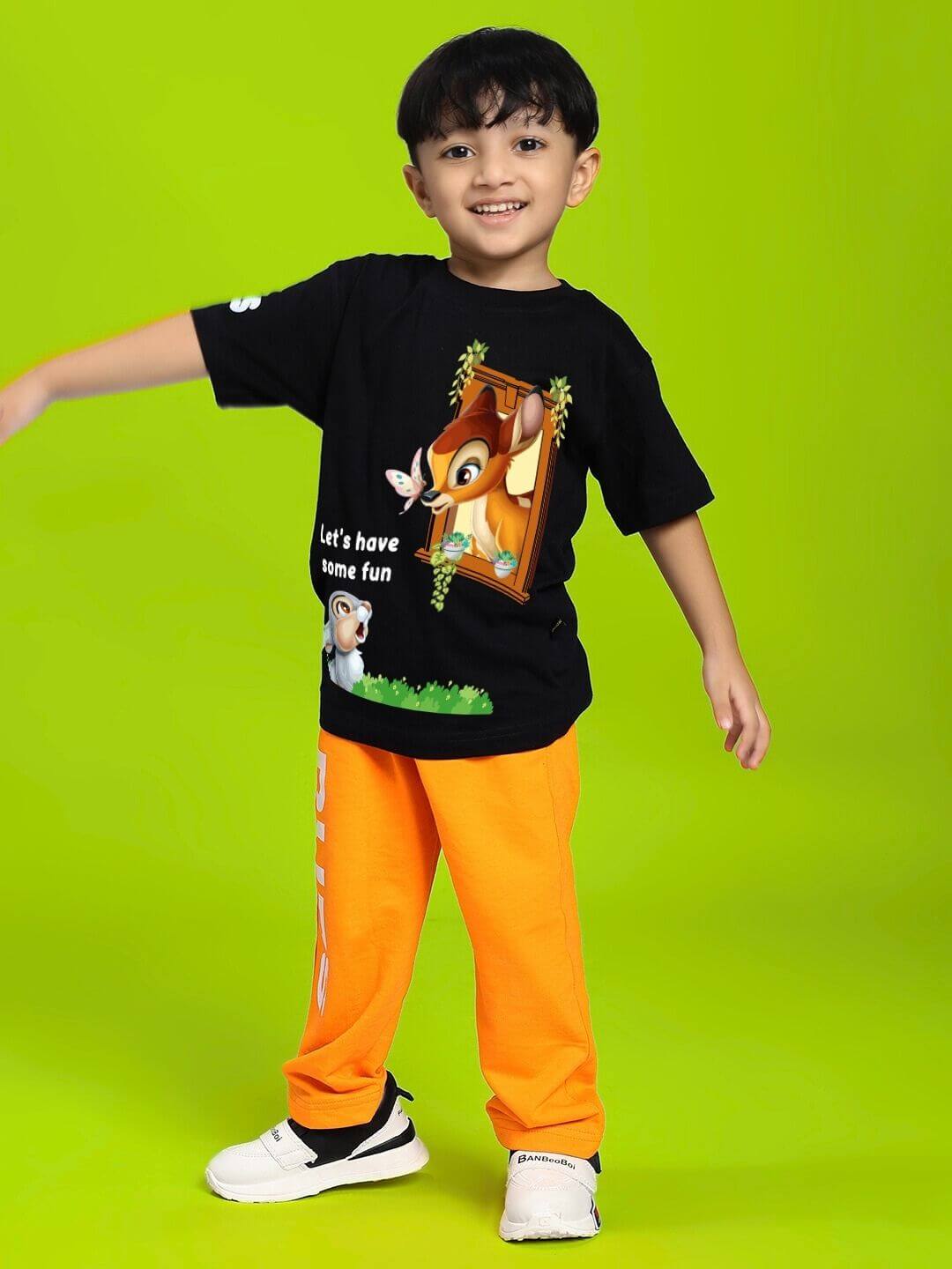 Boy wearing BAMBI TOON T-SHIRT FOR BOYS AND GIRLS BLACK with animated Bambi and Thumper design.
