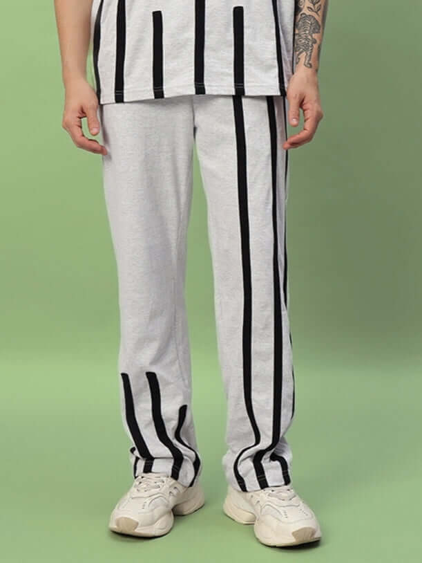 Model wearing Bastille Jogger in melange grey with black stripes, showcasing custom fit option by DUDS.