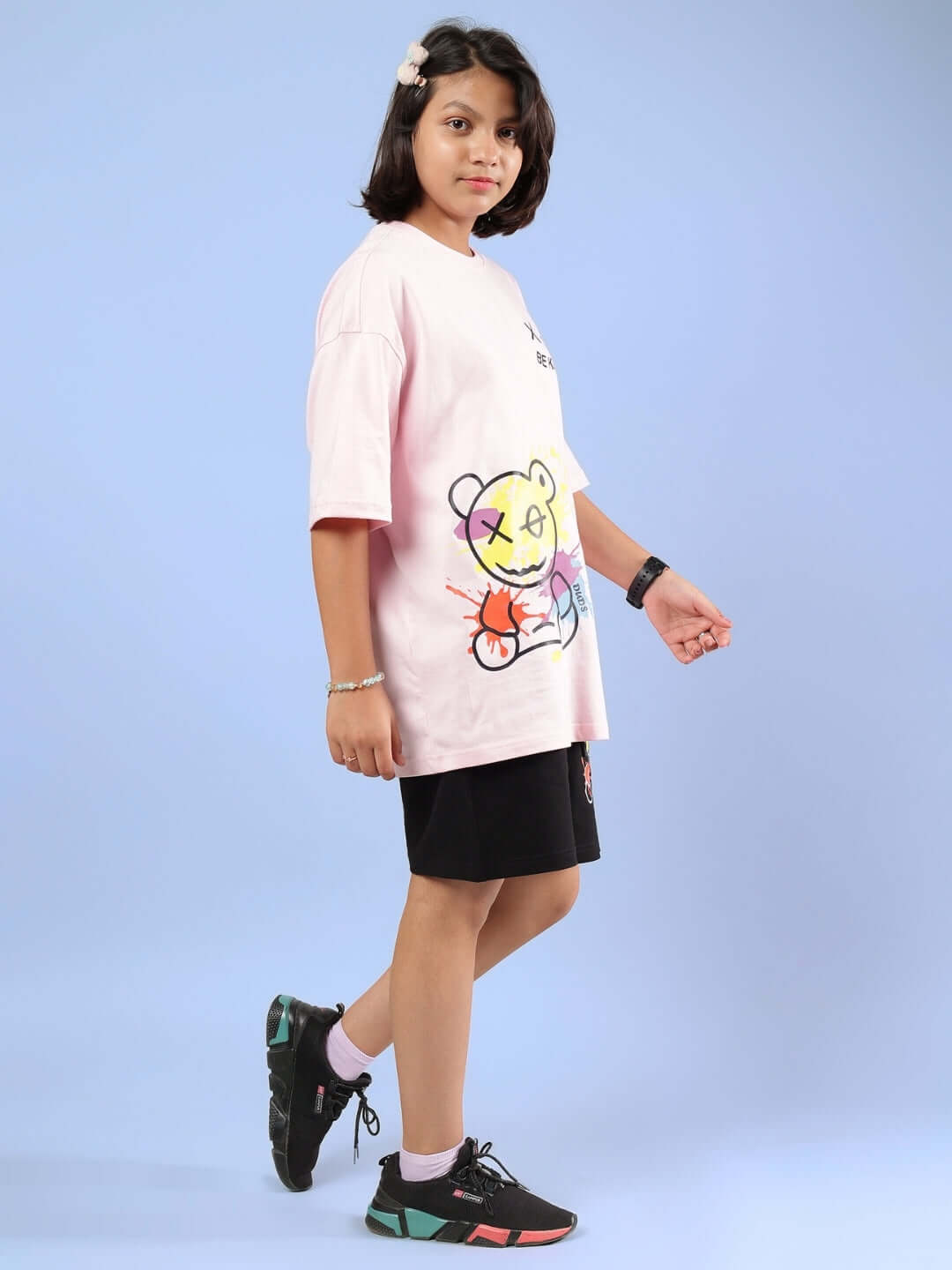 Child wearing BE KIND CO-ORD FOR BOYS GIRLS PINK-BLACK set with bear graphic, playful and comfortable outfit for kids.