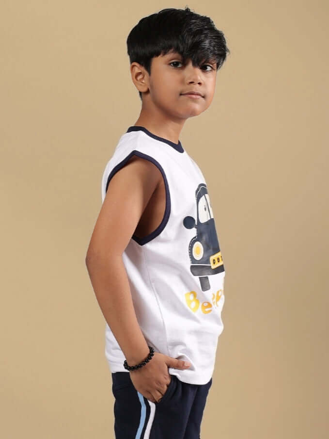 Boy wearing BEEP BEEP T-SHIRT FOR BOYS & GIRLS WHITE with cartoon car design, sleeveless style, showcasing casual fashion.