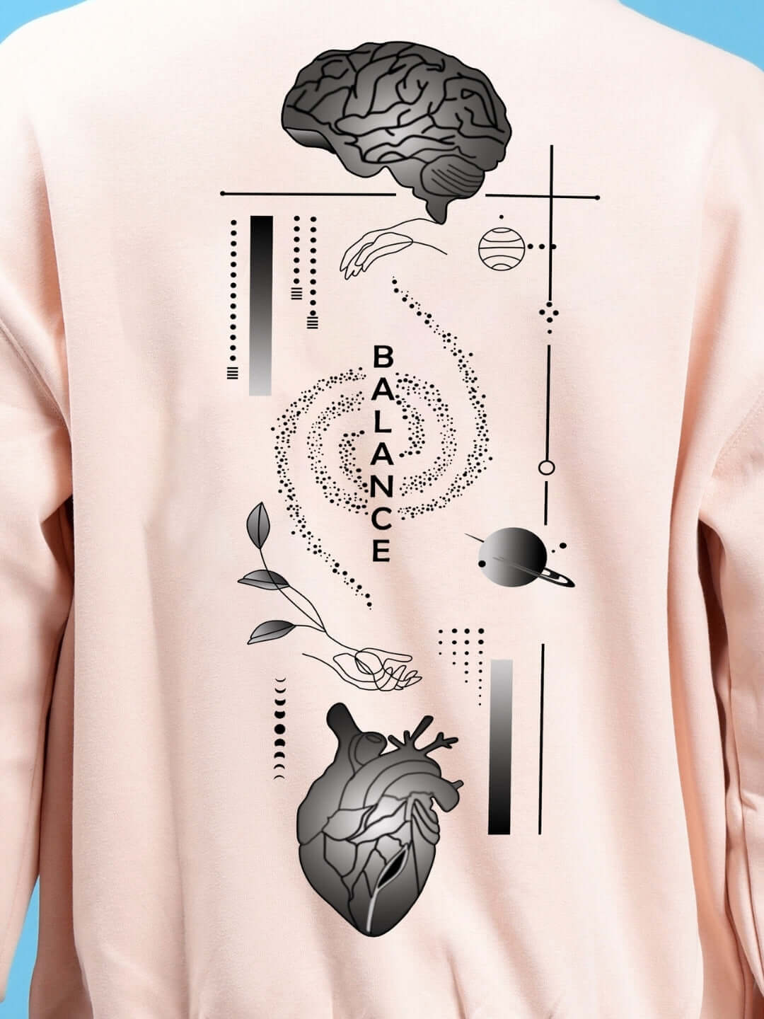 Close-up of BALANCE OVER-SIZED FLEECE HOODIES BEIGE with artistic back graphic, showcasing a brain, heart, and abstract designs for streetwear style.
