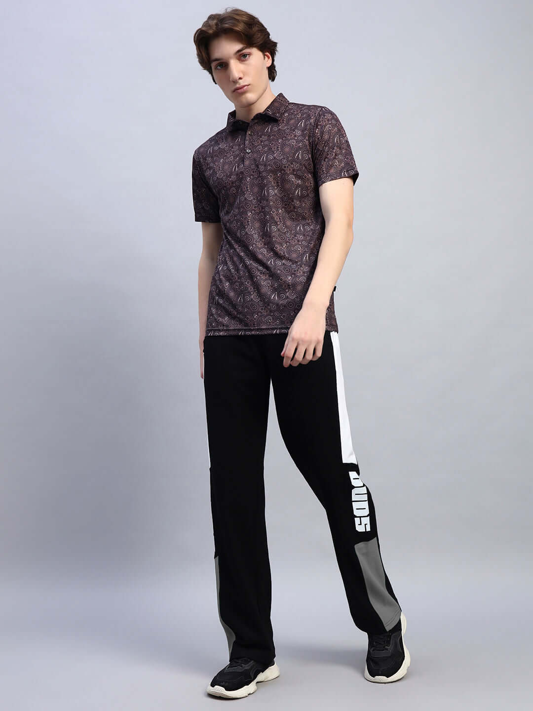 Model wearing BELGIANS RELAXED-FIT JOGGERS BLACK GREY in a stylish outfit, highlighting comfort and style.