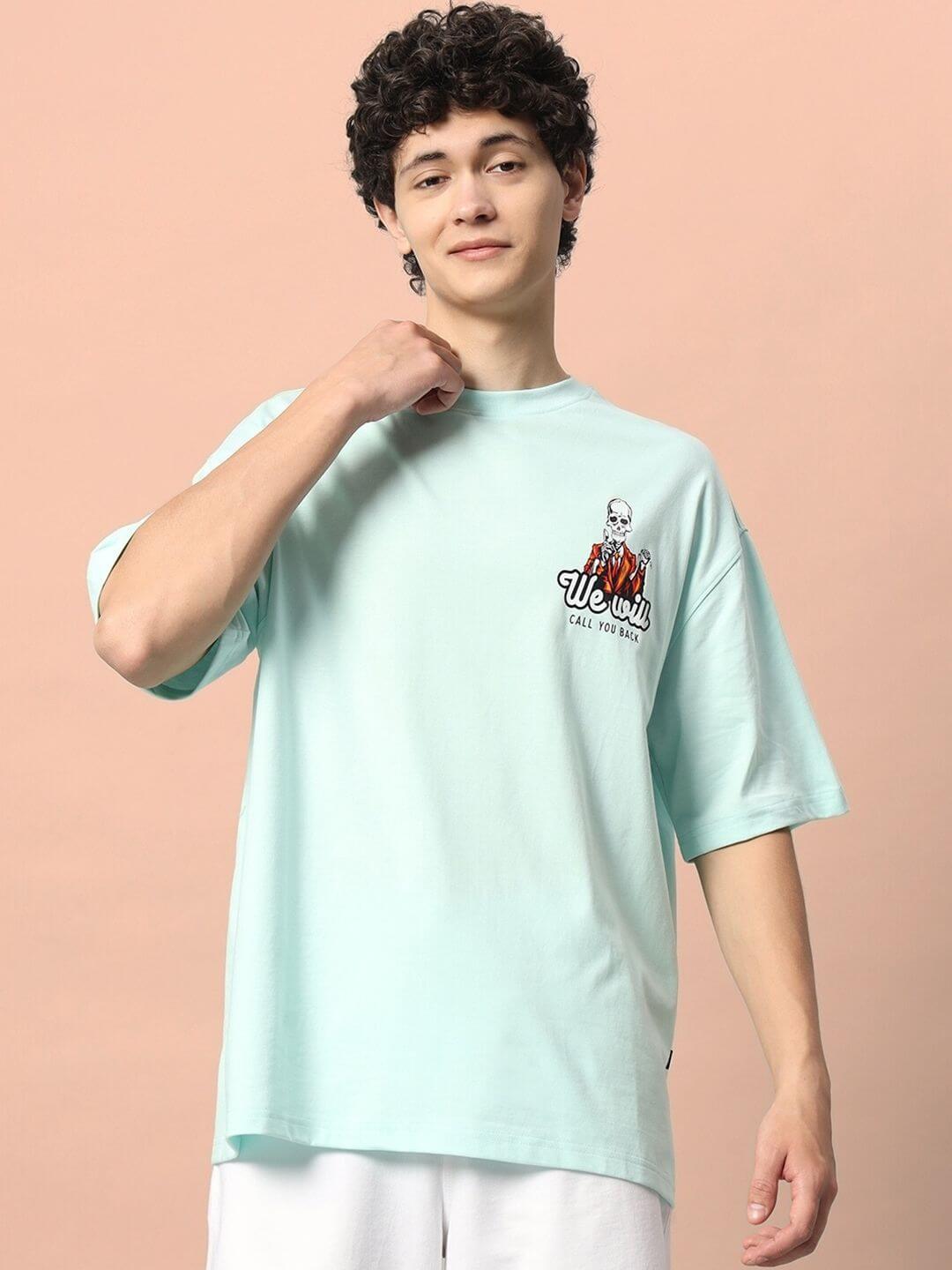Man wearing CALL YOU BACK OVER-SIZED T-SHIRT ICE BLUE with a stylish casual look.