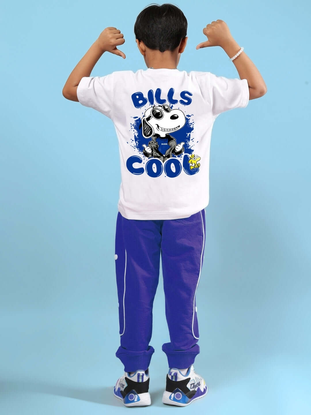 Boy wearing BILLS COOL CO-ORD FOR BOYS & GIRLS WHITE-BLUE outfit, showcasing back design in a playful pose.