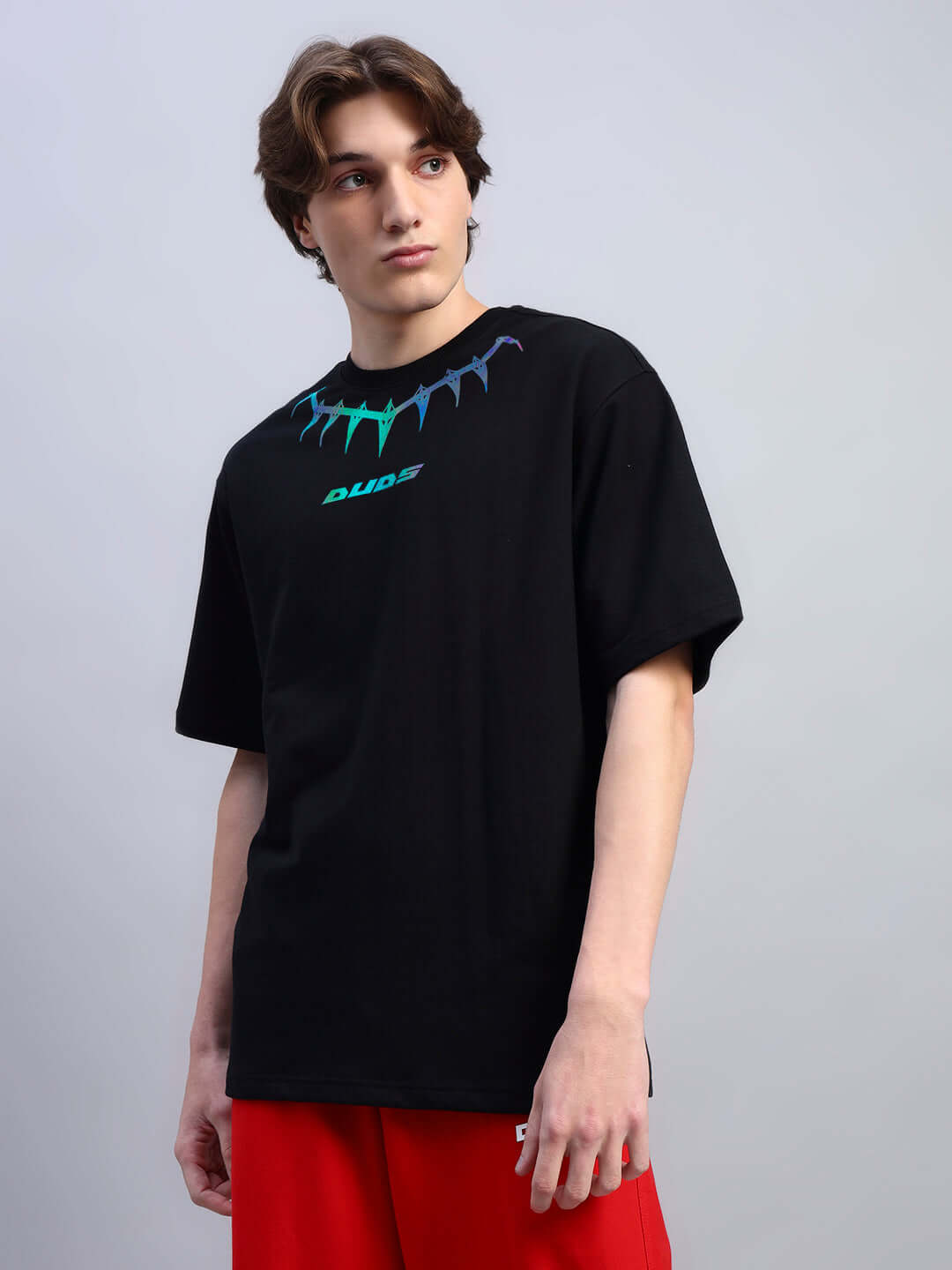 Model wearing Black Panther oversized t-shirt made of premium cotton and elastane, showcasing unique reflector style. Ideal for casual wear.