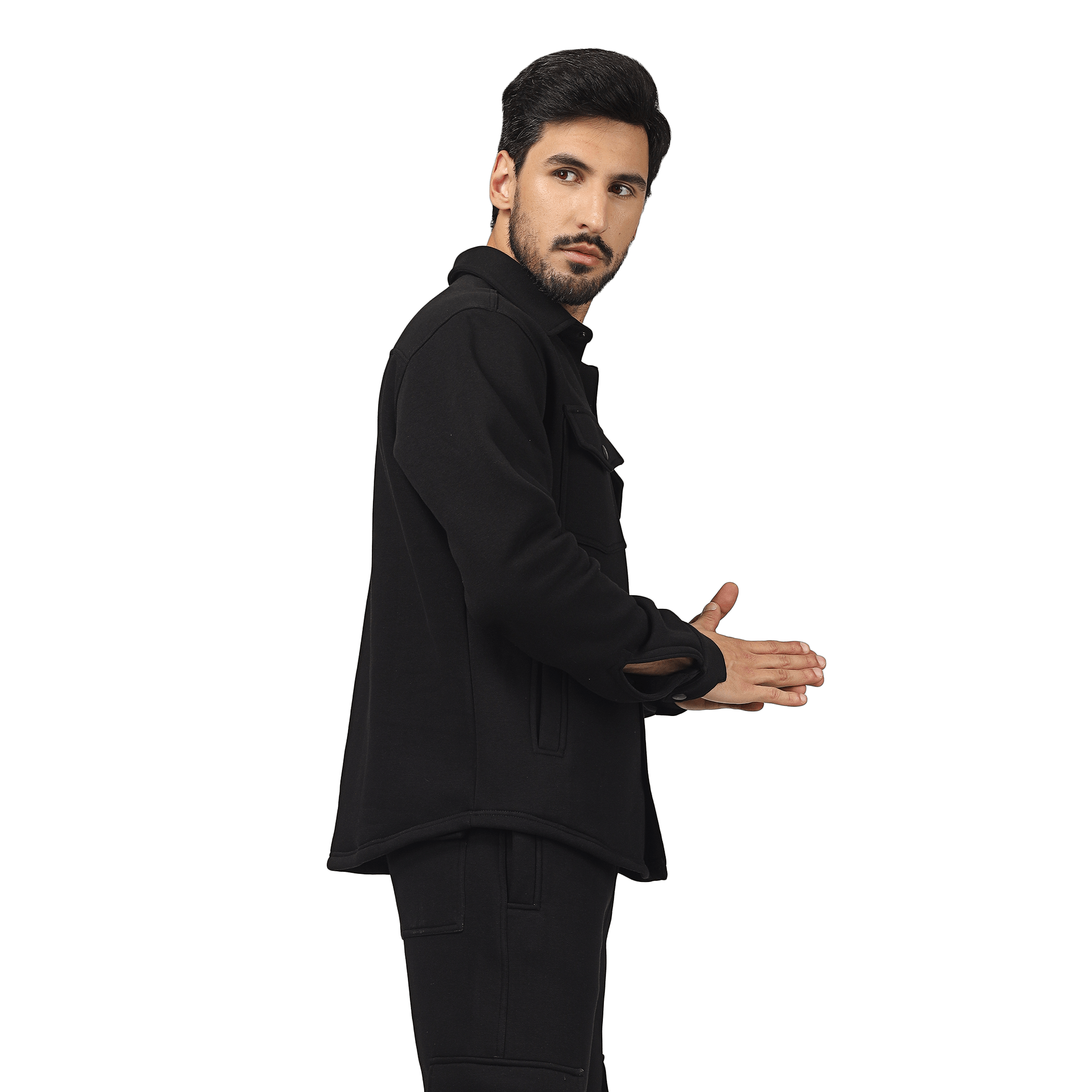 Man wearing a black relaxed fit full overshirt, showcasing casual streetwear style.