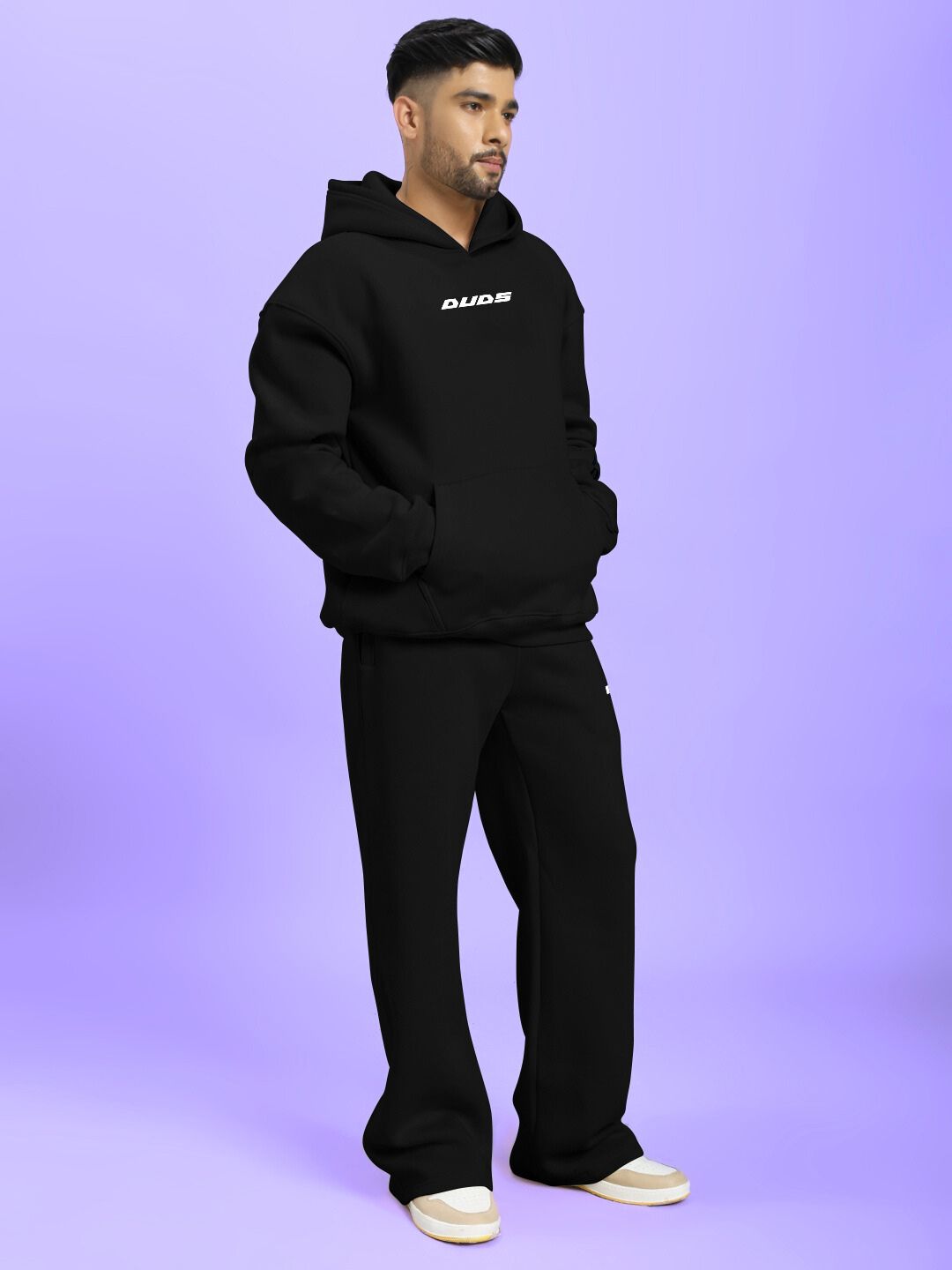 Man wearing SILVER SURFER FLEECE CO-ORD SET BLACK on a purple background.