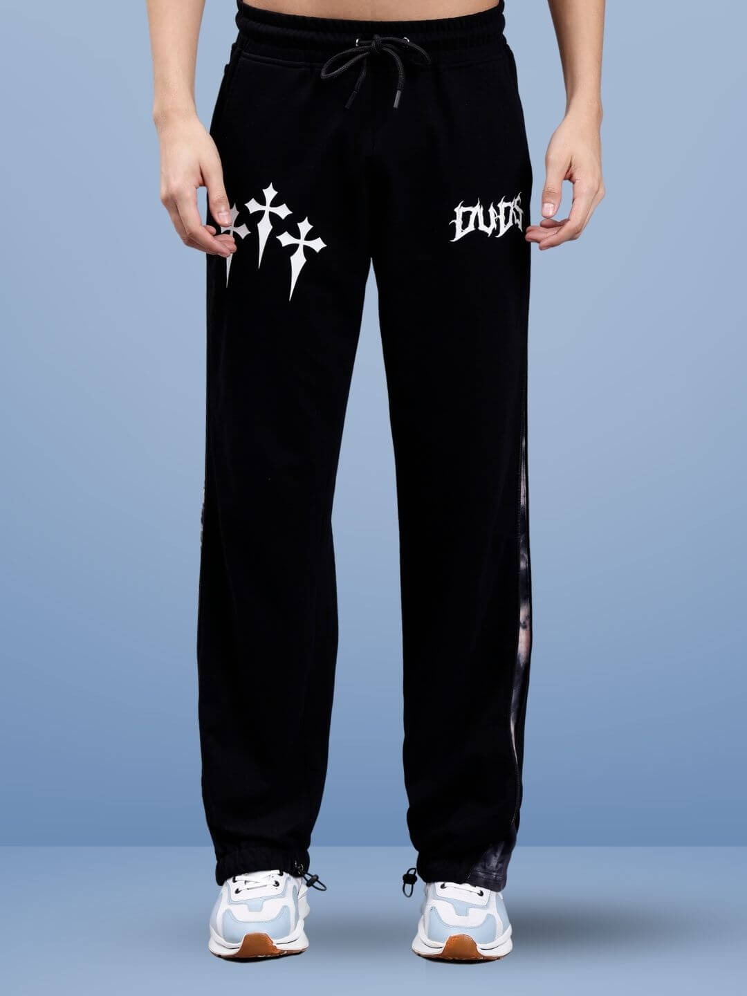 Model wearing black joggers with white logo, highlighting the zipper panel design.