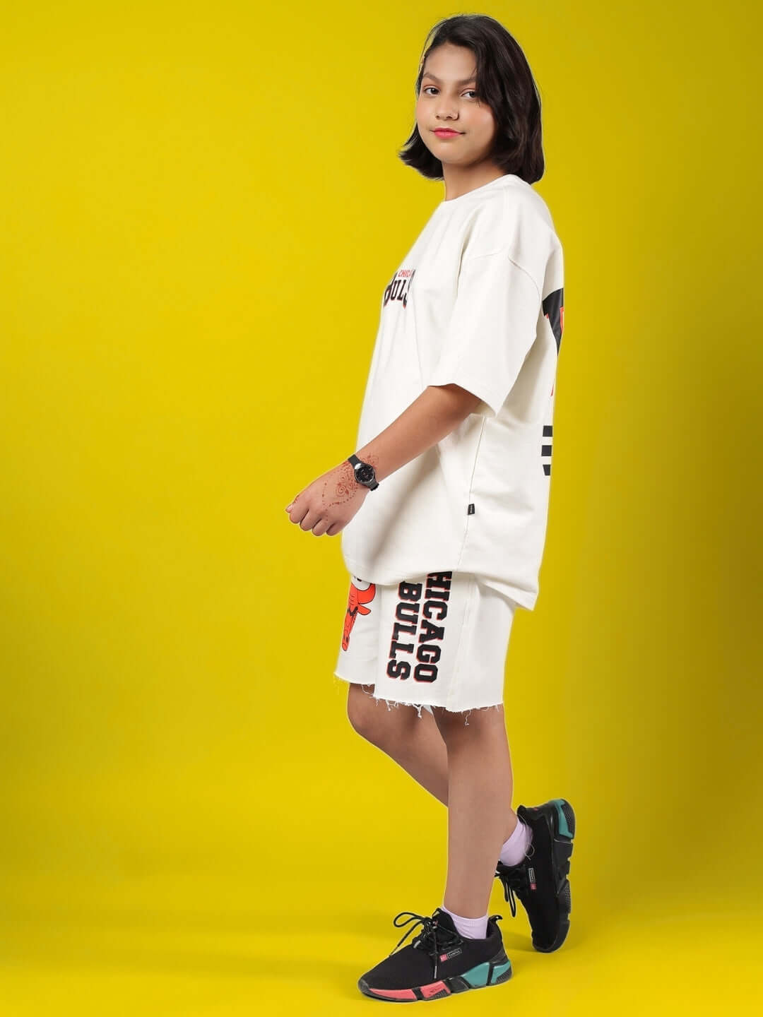 Child wearing BLAZE BULLS CO-ORD FOR BOYS & GIRLS OFF WHITE against yellow background