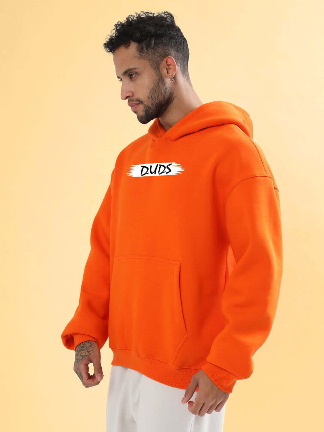 Model wearing Bloom Quote Fleece Oversized Hoodie Orange with a casual, relaxed fit.