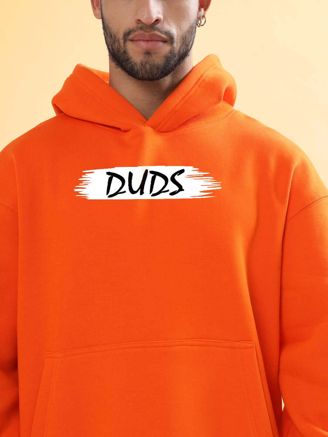 BLOOM QUOTE FLEECE OVERSIZED HOODIE ORANGE with bold text design, perfect for casual streetwear style.