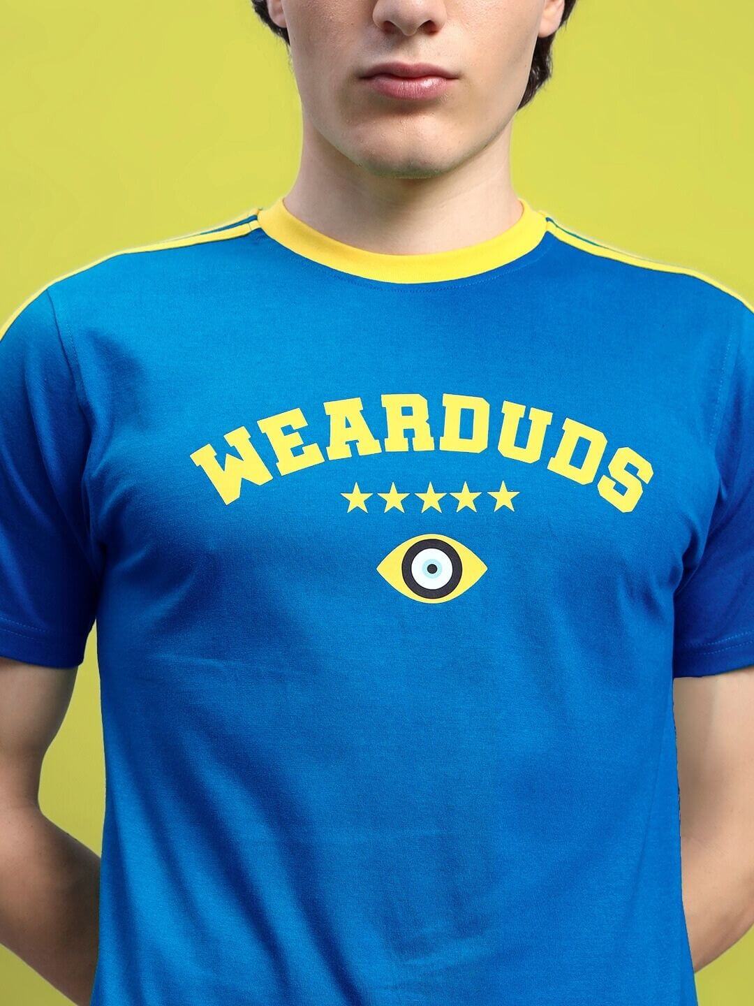 Blue Irish regular fit t-shirt with a yellow collar and 'WEARDUDS' print, made from 100% cotton, worn by a model, bright yellow background.