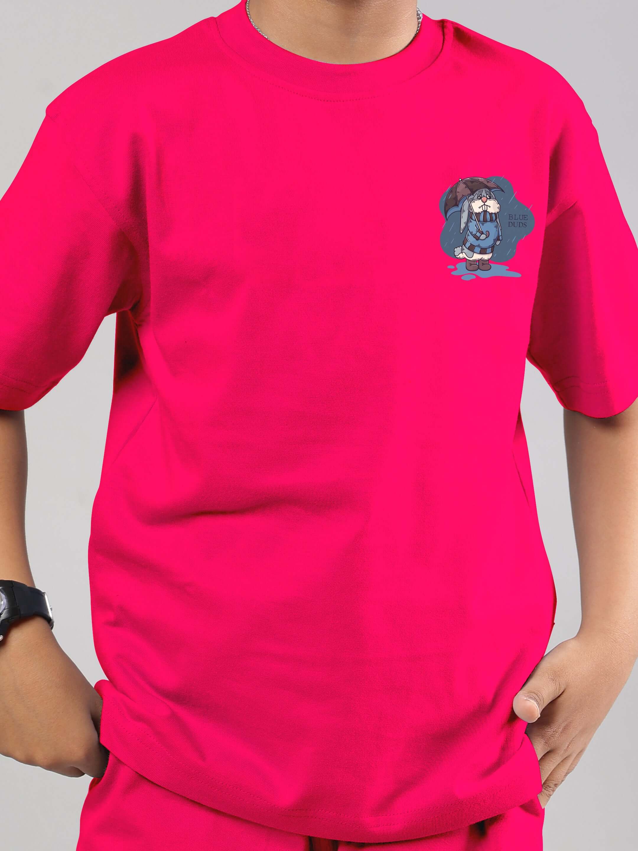 Child wearing pink BLUE LAPIN T-shirt with bunny graphic, unisex premium cotton 200 GSM bio-washed fabric, hand in pocket, stylish casual look.