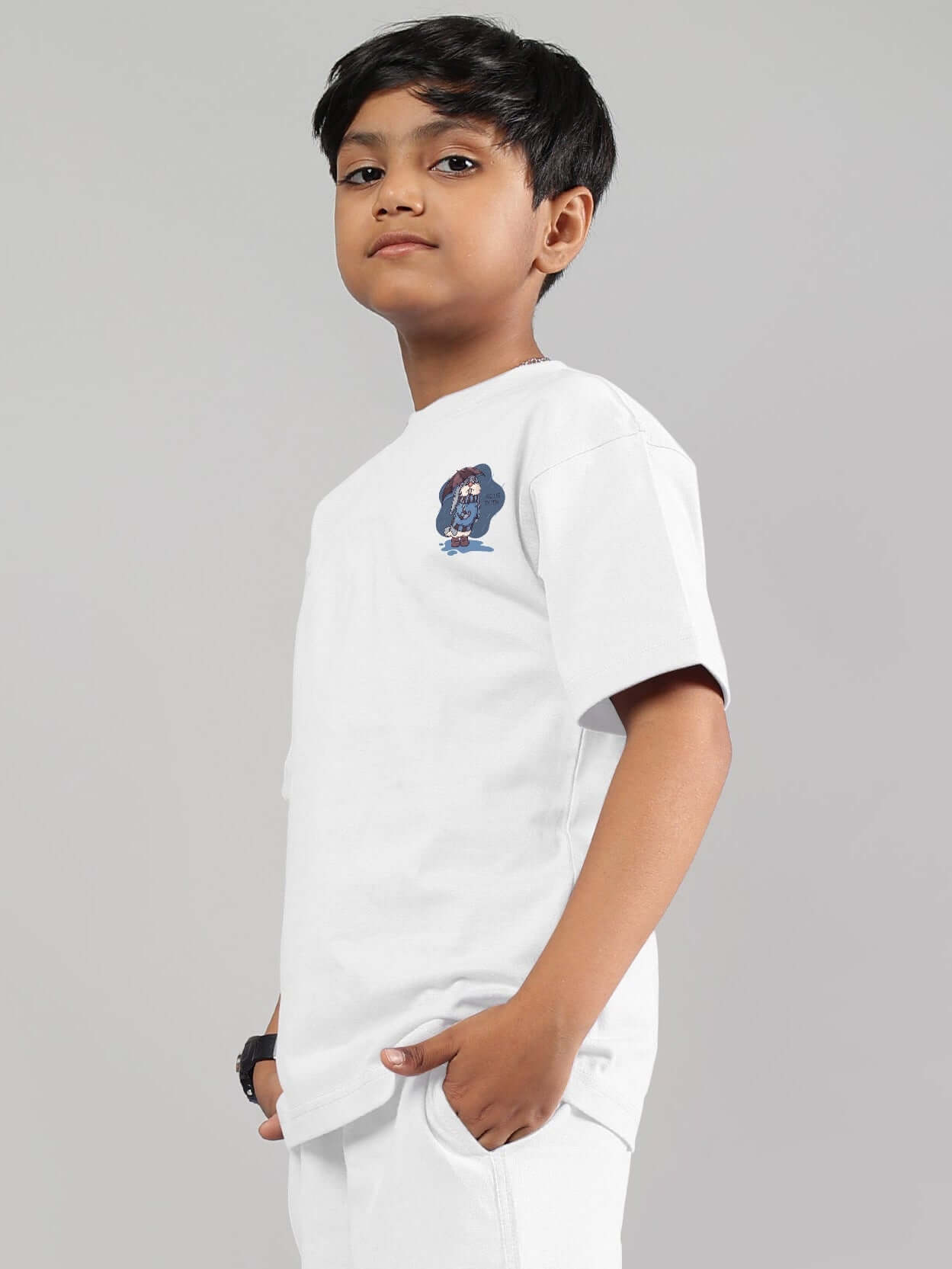 Boy wearing a white Blue Lapin t-shirt from DUDS, side view showcasing design, suitable for custom fit options.