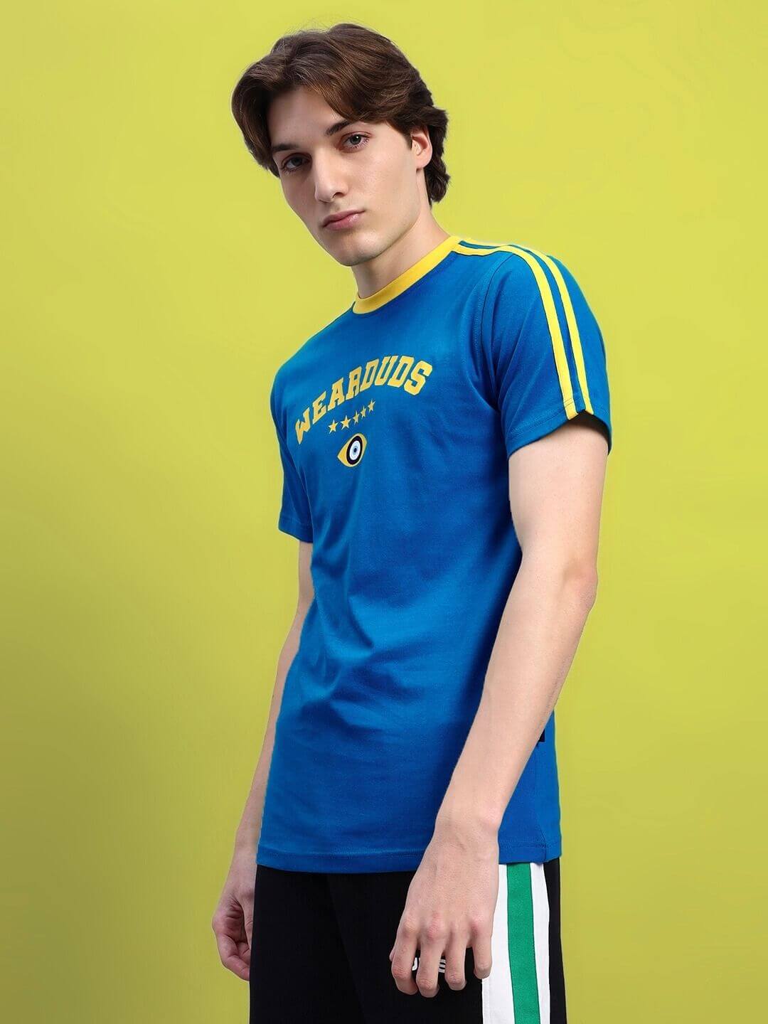 Model wearing Irish Regular Fit T-Shirt in blue with yellow stripes, made from 100% cotton. Premium heavy gauge fabric, 220 GSM bio-washed.