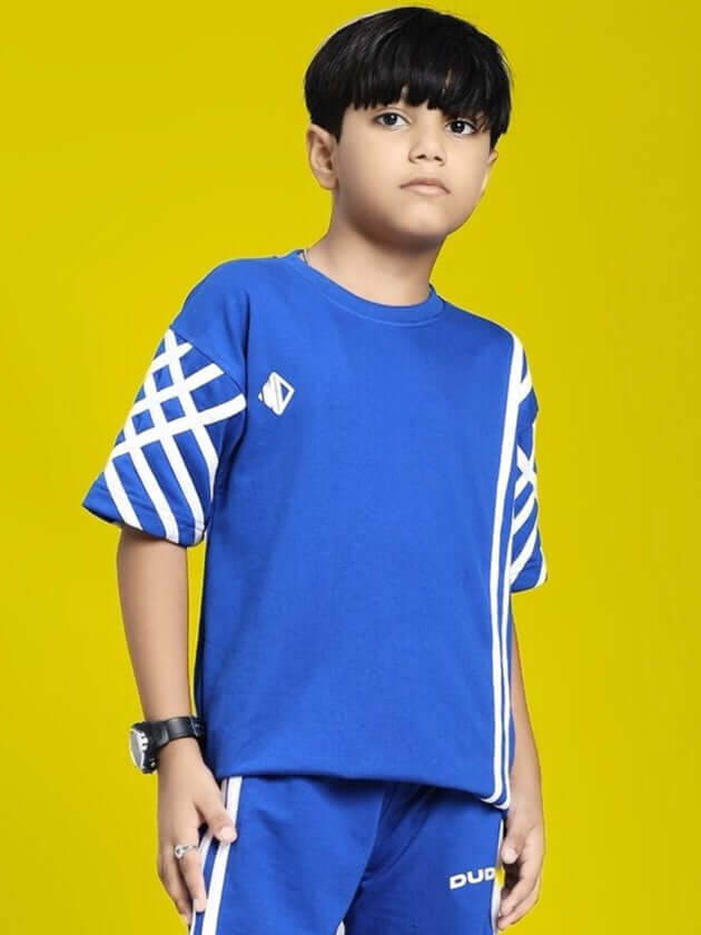 Child wearing UNITED STRIPE T-SHIRT FOR BOYS AND GIRLS BLUE on yellow background