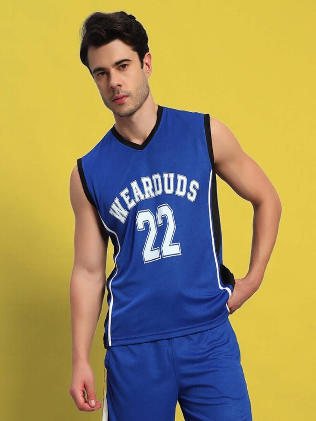Man wearing Portia Gym T-shirt in royal blue with 'Wearduds' text and number 22, offering custom fit options.