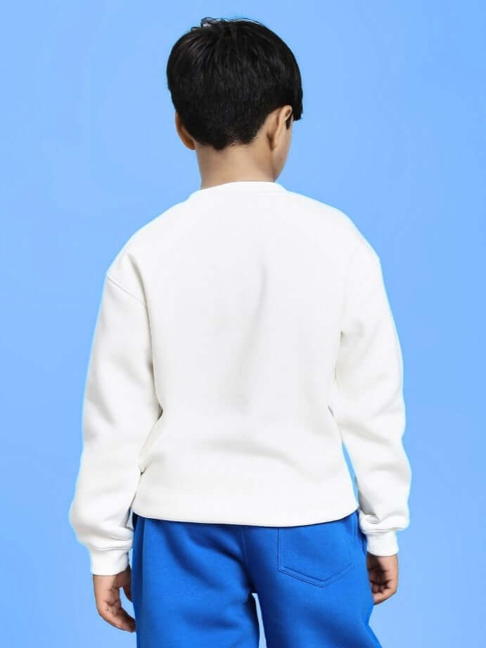 Child wearing BLUEY BINGO FLEECE SWEATSHIRT FOR BOYS AND GIRLS WHITE, view from the back, against a blue background.