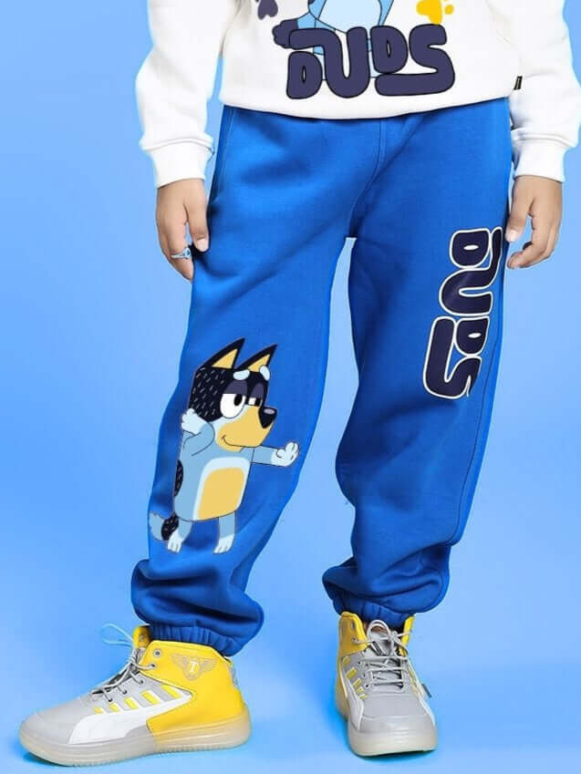 Child wearing BLUEY BINGO FLEECE JOGGER FOR BOYS AND GIRLS BLUE with colorful sneakers and a themed sweater.