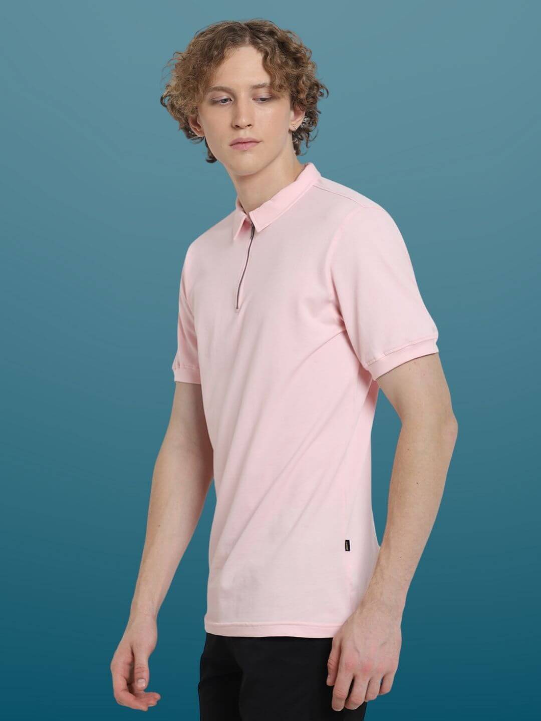 Blush pink zipper polo neck t-shirt with half sleeves on male model, showcasing a comfortable slim fit and wrinkle-free fabric.