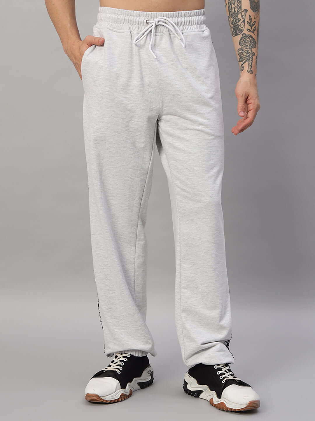 Person wearing Boogie Oversized Co-ord Set Melange Grey shorts with sneakers, showcasing streetwear style.