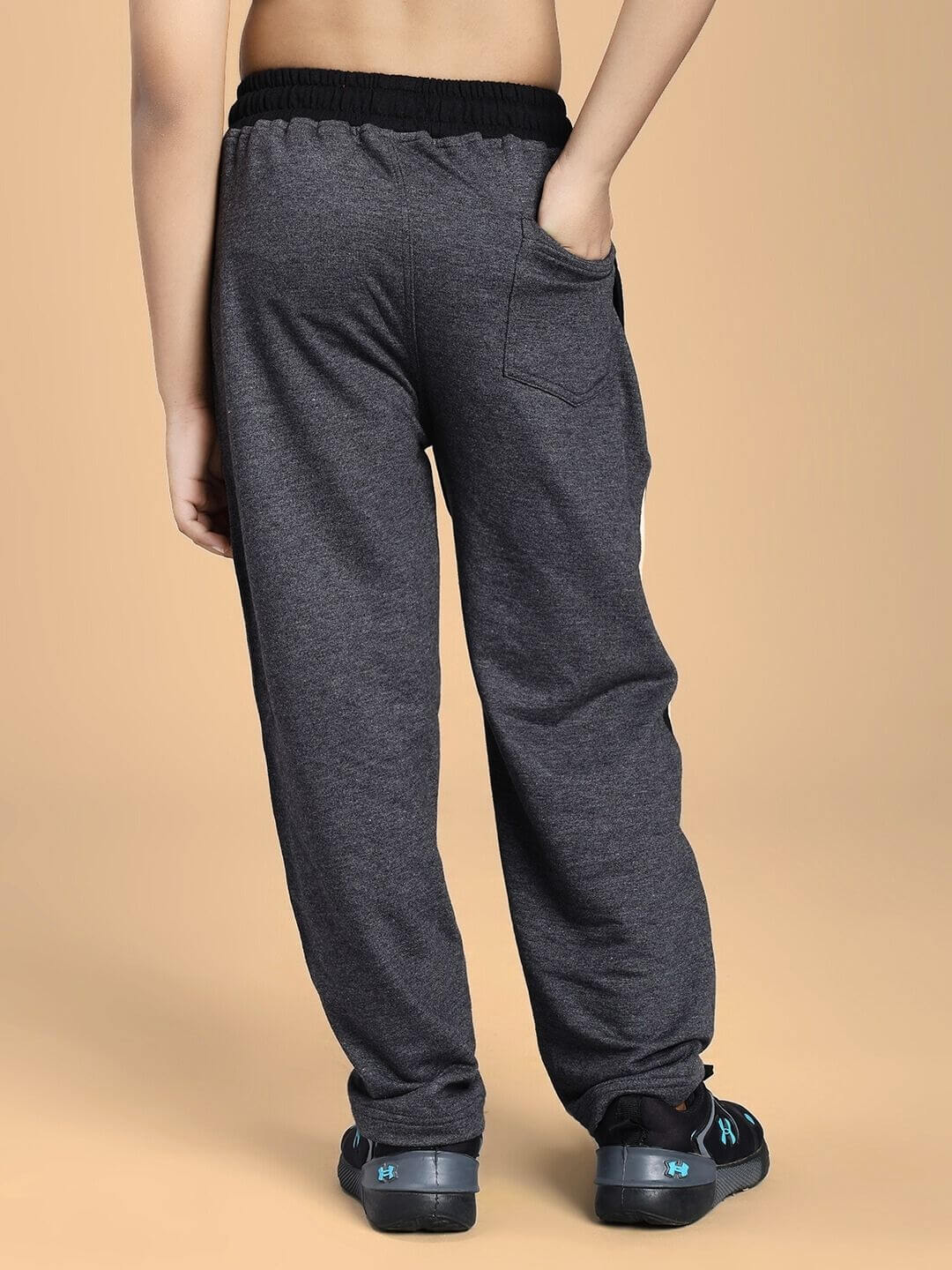 BOSCO STRIPE JOGGER FOR BOYS AND GIRLS BLACK DARK GREY shown from the back with elastic waistband and pocket for active kids