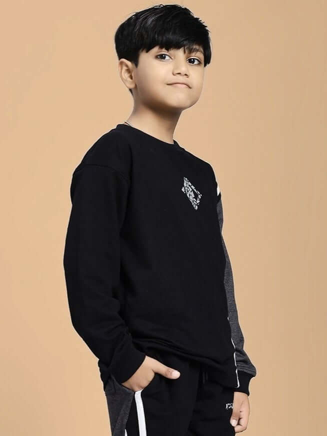 Boy wearing BOSCO STRIPE SWEATSHIRT BOYS AND GIRLS BLACK DARK GREY showcasing modern streetwear style.