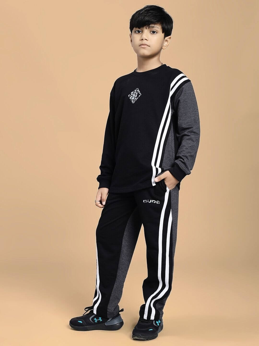 Child wearing BOSCO STRIPE CO-ORD SET FOR BOYS AND GIRLS BLACK DARK GREY with striped sweatshirt and joggers