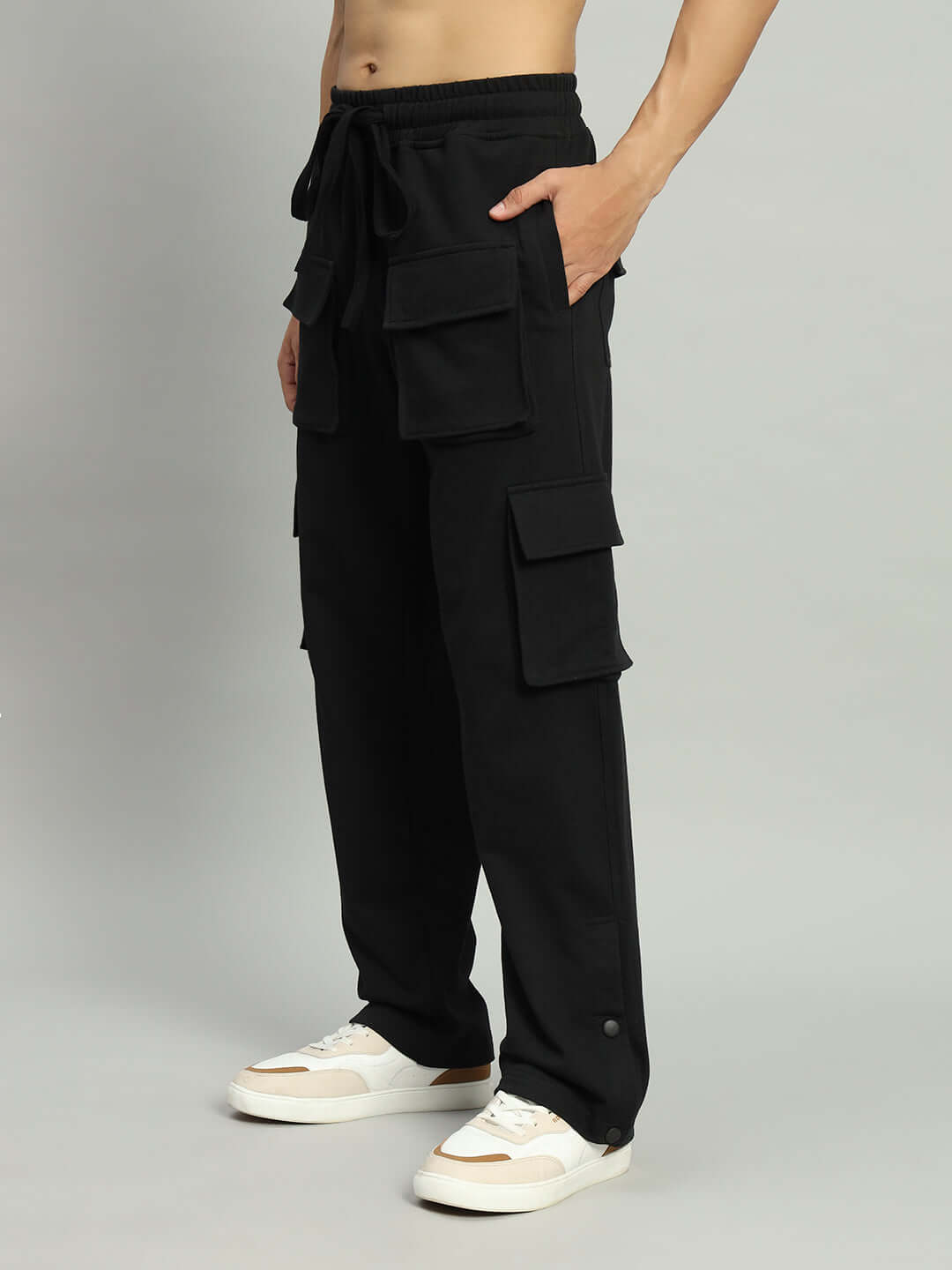 Model wearing black BRACE 8 Pocket Cargo Pant with multiple pockets, tailored by experienced DUDS tailors. Made to order, custom fit available.