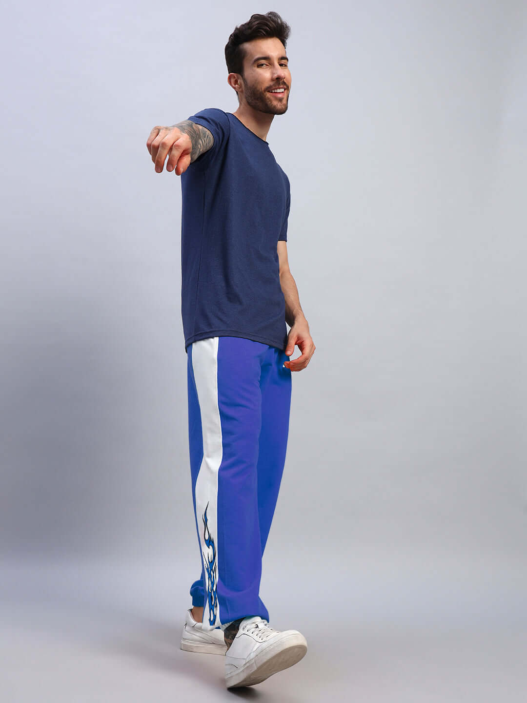 Man wearing BRACER RELAXED FIT JOGGERS BLUE-WHITE, showcasing comfort and style with a two-tone design, perfect for casual wear and travel.