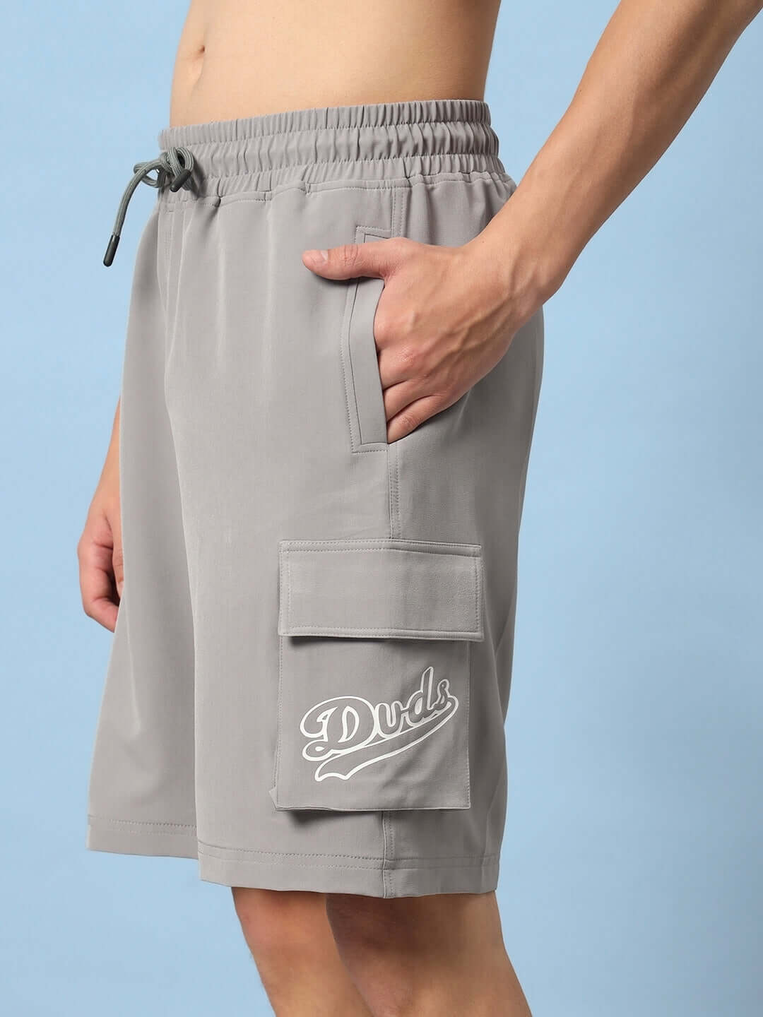 Alt Tag: Brawny Grey Cargo Shorts by DUDS with custom fit option, featuring side pockets and drawstring, ideal for casual wear.