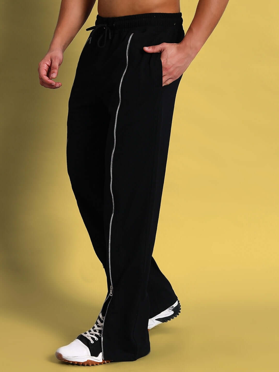Man wearing black Brazo front open zipper joggers with drawstring and relaxed fit.