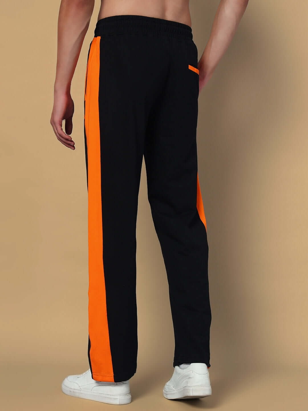 Black joggers with orange side contrast from DUDS, tailored and customizable, designed for style and comfort.