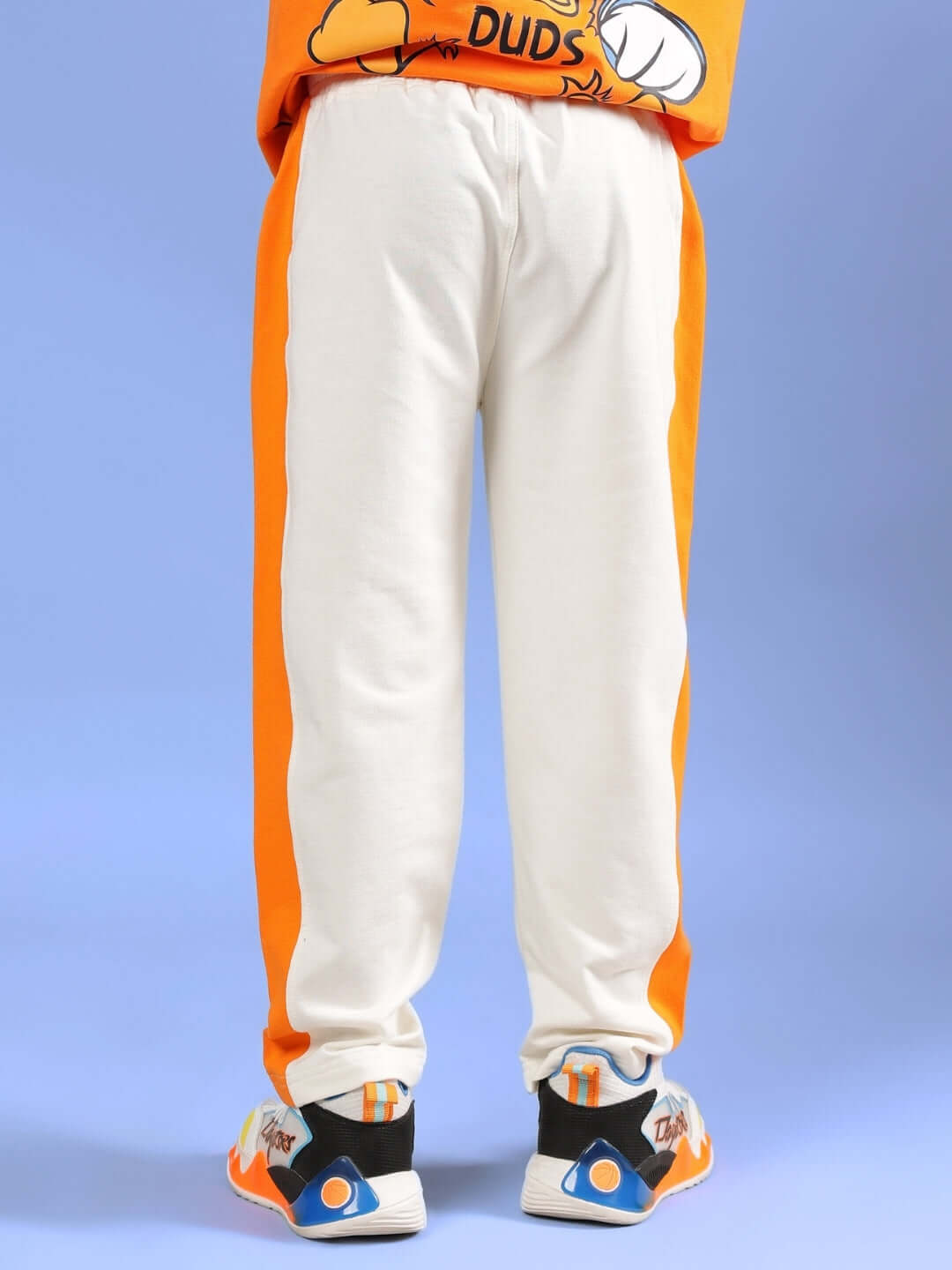 Breezer jogger for kids in off-white and orange, featuring a comfortable fit and custom-tailoring options by DUDS.