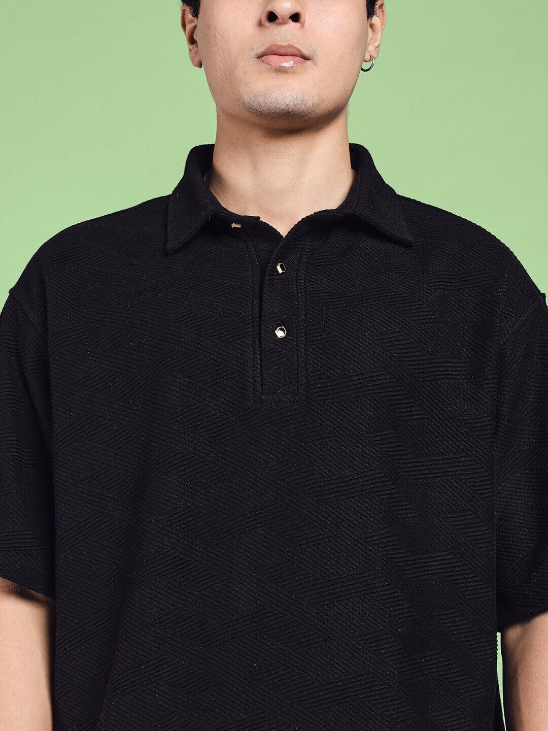 Man wearing a BROCADE POLO COTTON T-SHIRT BLACK in jacquard fabric indoors