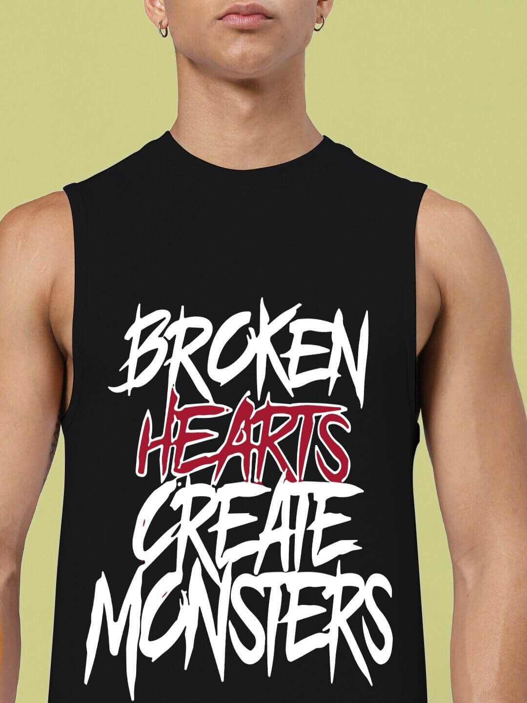 BROKEN HEART PRINT SLEEVELESS T-SHIRT BLACK with bold graphic text, modern streetwear fashion, crafted from premium cotton.