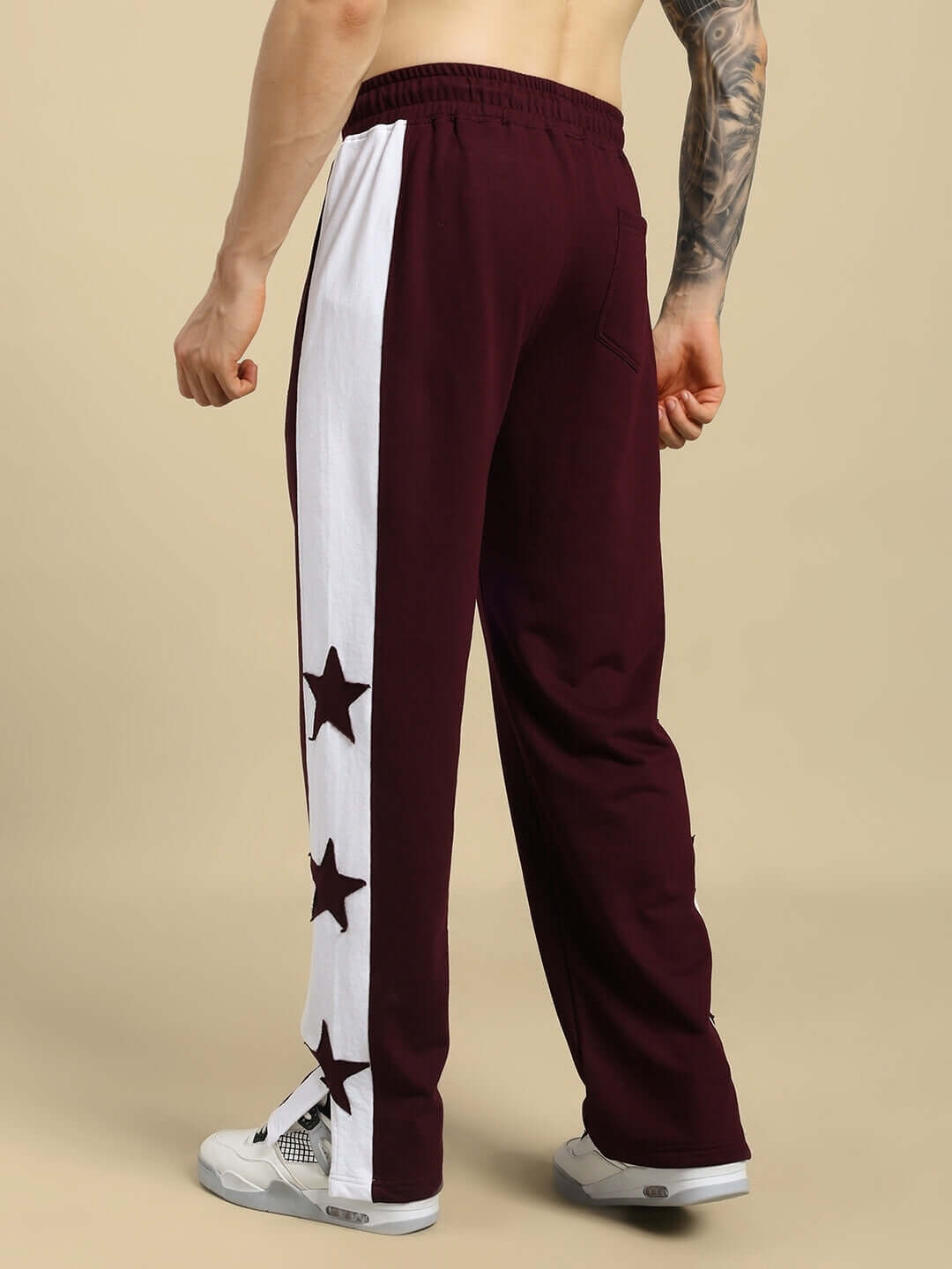 Rear view of BROX STAR Relaxed Fit Joggers in maroon and white, featuring star accents, ideal for custom fit by DUDS tailors.
