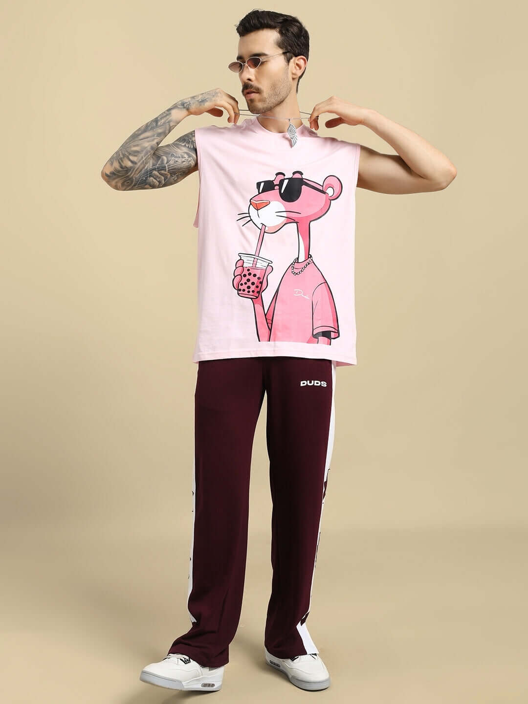 Man wearing BROX STAR Relaxed Fit Joggers in maroon-white and a graphic t-shirt, showcasing casual style attire.