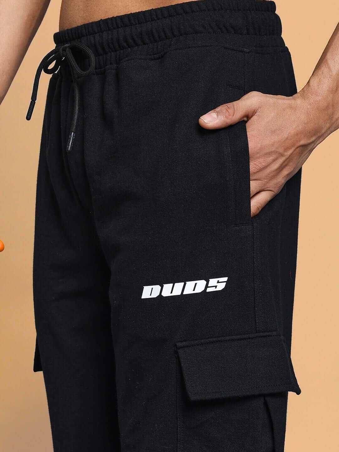 Close-up of black BRUNO 5 Pocket Cargo Pant by DUDS with visible pocket detail, perfect for custom sizing and made to order.