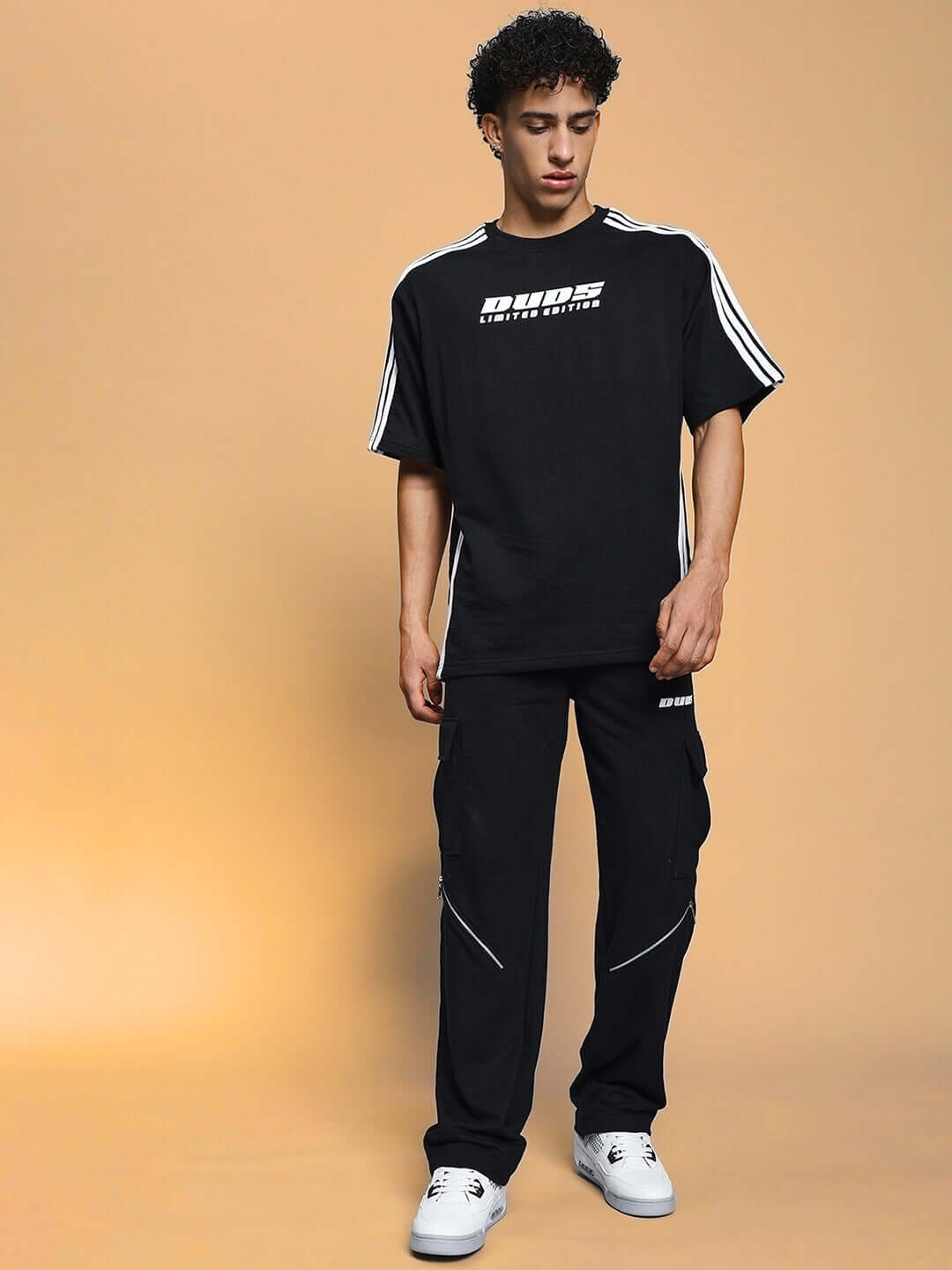 Model wearing black BRUNO 5 Pocket Cargo Pant from DUDS, featuring customization options and tailored craftsmanship.