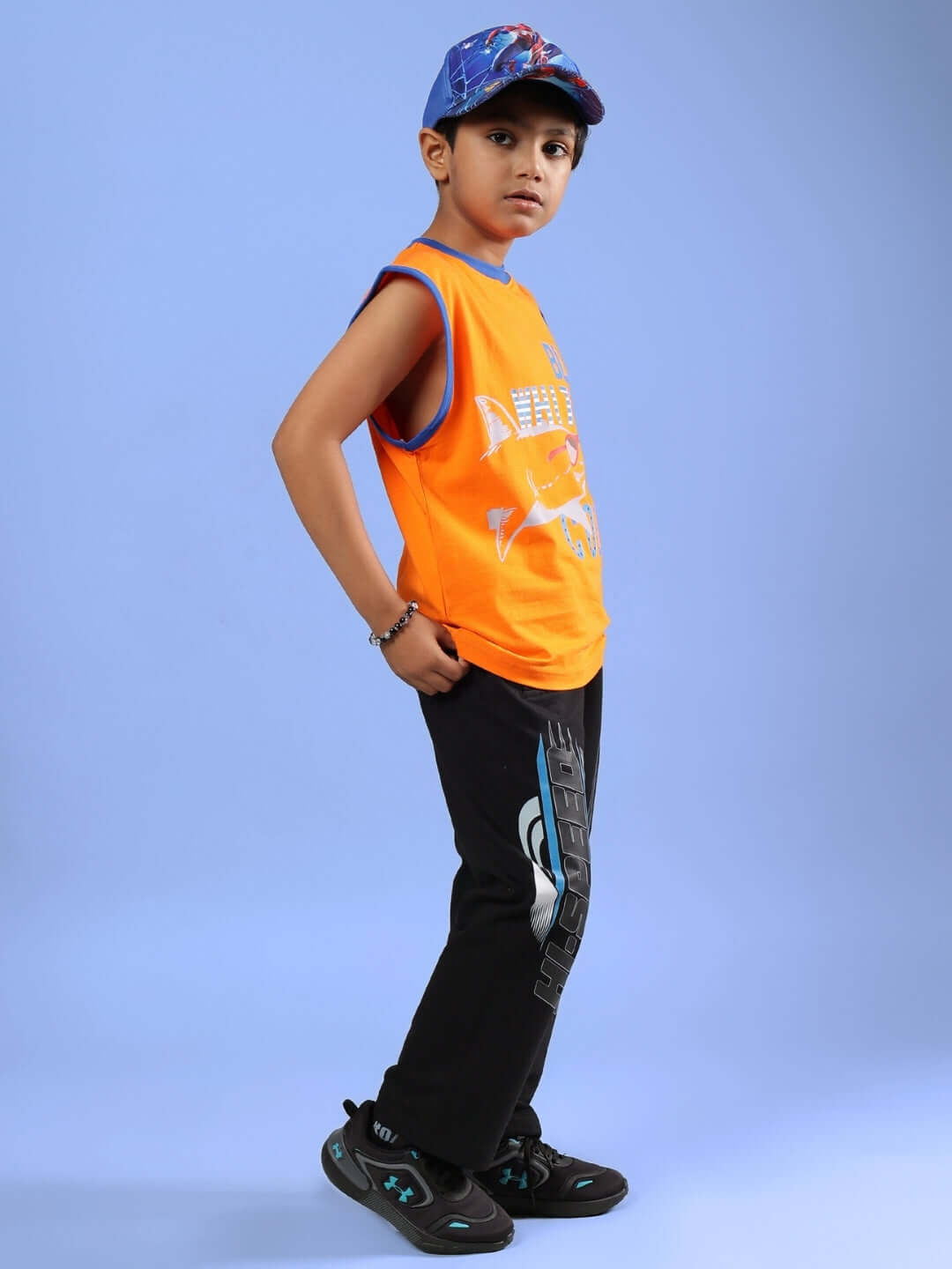 Alt Tag: Child wearing BUFFY CO-ORD FOR BOYS & GIRLS ORANGE BLACK outfit, showcasing orange and black fashion style.