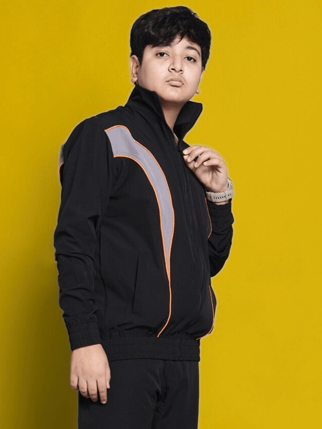 Bullet Parachute Jacket for Boys & Girls in Black, worn by a model against a yellow background.