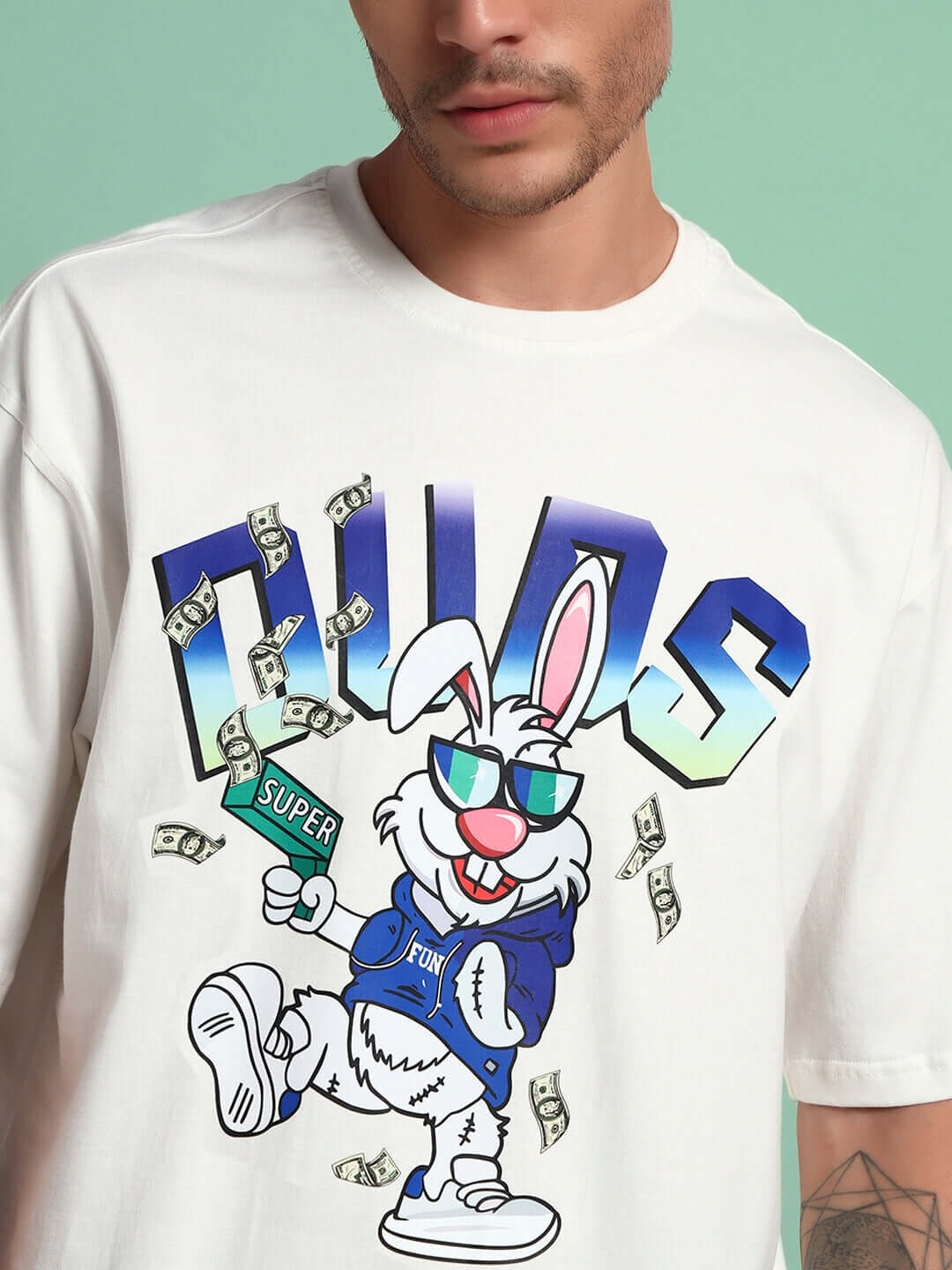 Off-white BUNNY BUGS CO-ORD SET with blue print featuring cartoon rabbit and dollar bills; made of premium cotton blend.