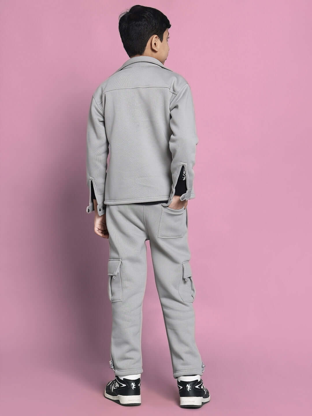BURLY CO-ORD SET FOR BOYS & GIRLS GREY - back view of child wearing grey two-piece outfit with pink background.